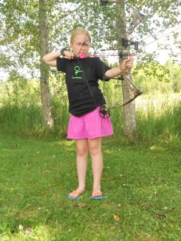 Junior pro staffer Alex shoots pink arrows from Victory