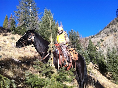 girl on horseback for Colorado elk hunt