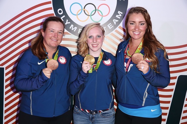 RIO DE JANEIRO, BRAZIL - AUGUST 14: (L-R) U.S. Olympians Kim Rhode, Virginia Thrasher and Corey Cogdell pose for a photo with their medals at the USA House at Colegio Sao paulo on August 5, 2016 in Rio de Janeiro, Brazil. (Photo by Joe Scarnici/Getty Images) *** Local Caption *** Kim Rhode; Virginia Thrasher; Corey Cogdell