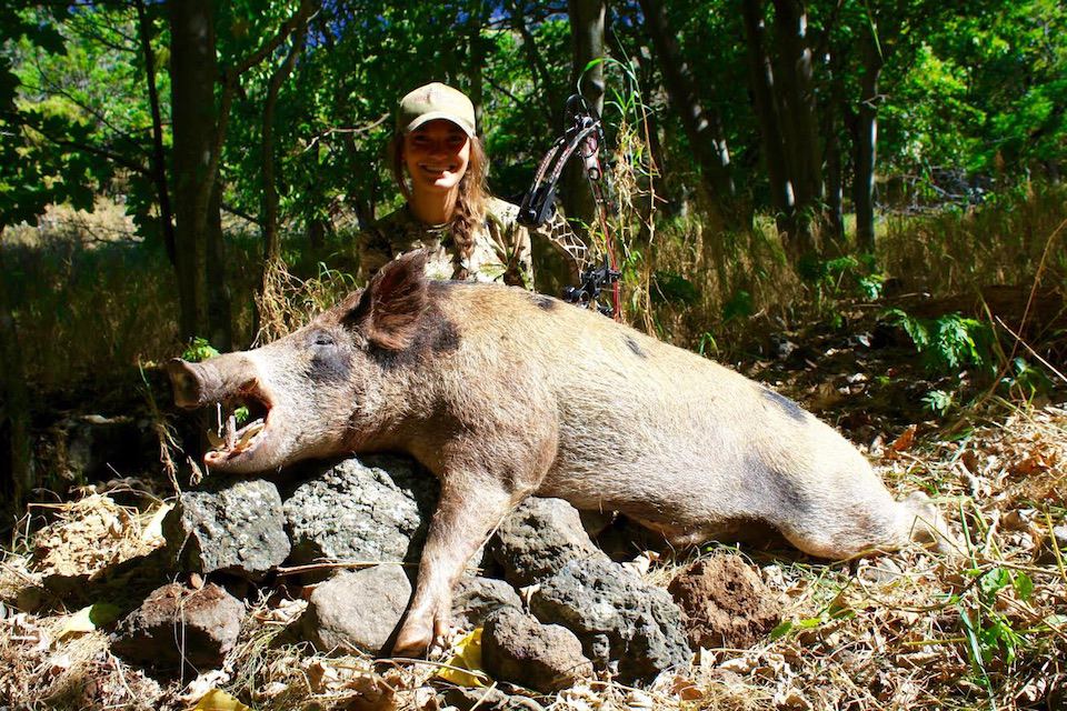 Emily Perreira 06 Emily with pig harvest