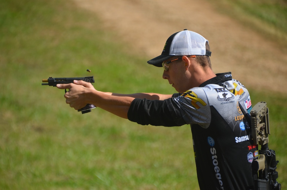 Young adult Tim shooting pistol