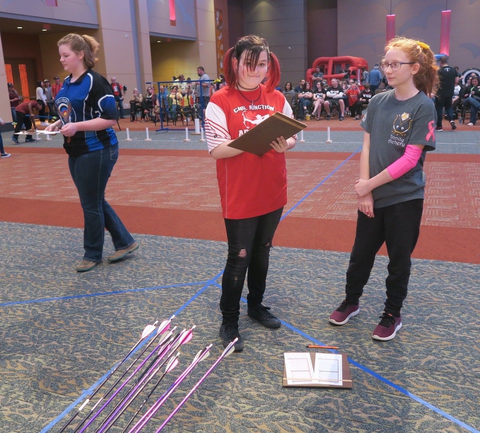 Girls scoring 3D archery