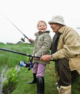 old man fishing with little girl