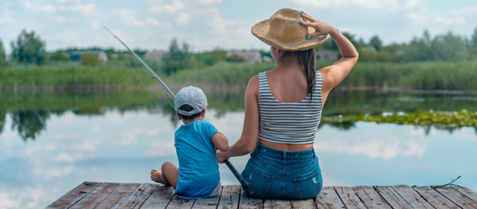 mom and kid on dock fishing