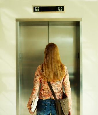 Situational awareness woman elevator