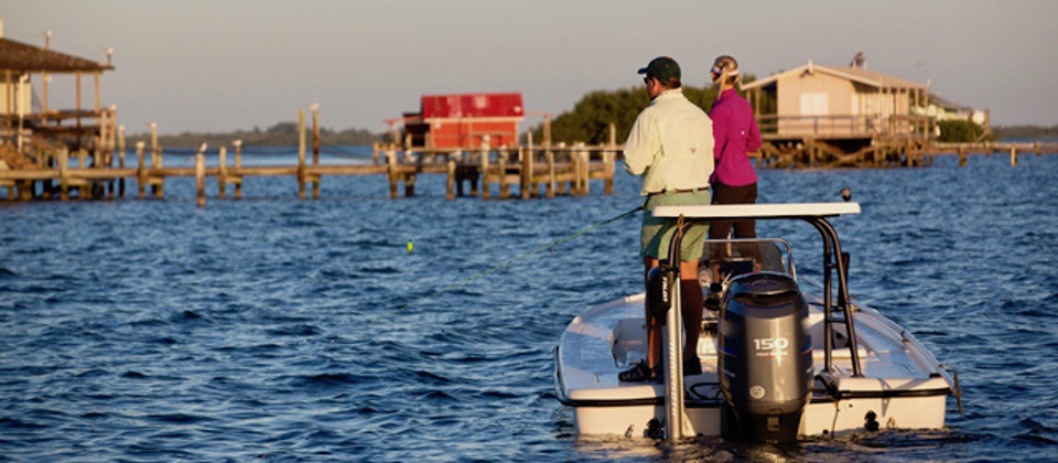 couple recreational fishing off boat