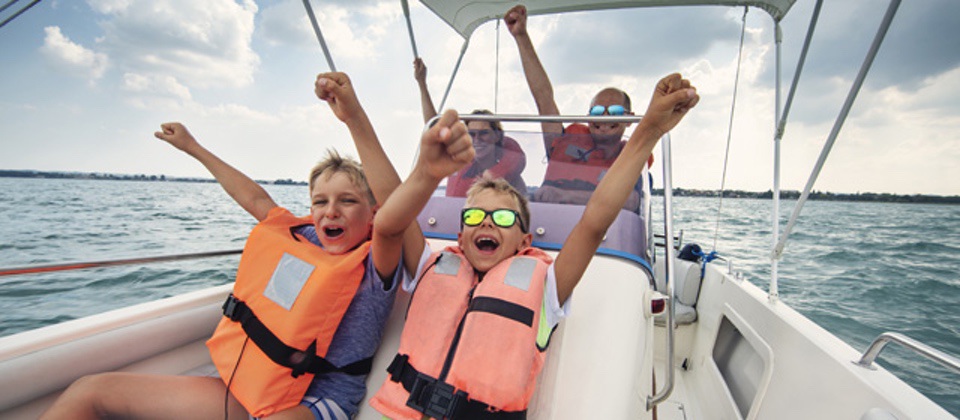 Family enjoying riding a boat on Lake Garda Low Maintenance Boats TakeMeFishing