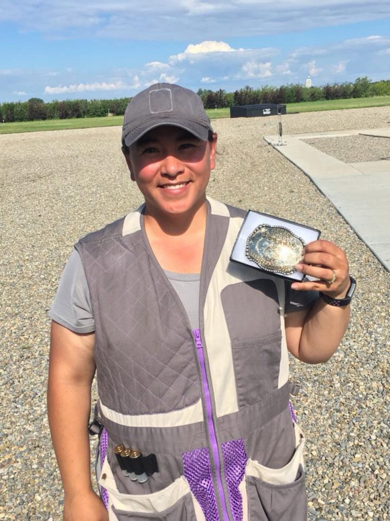 Syren Trap Shooter Emi Smith with belt buckle