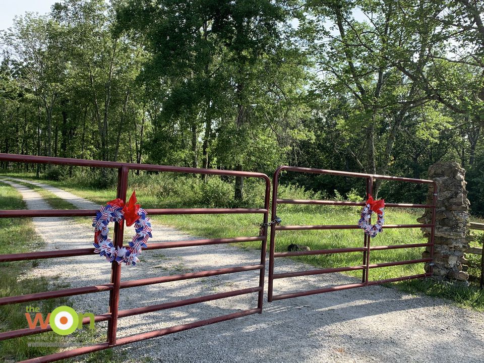 gates with pinwheel wreaths for Fourth of July