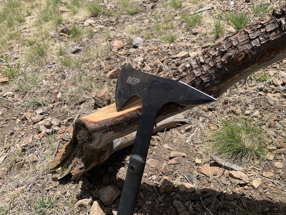 Smith & Wesson Extraction and Evasion Axe on log
