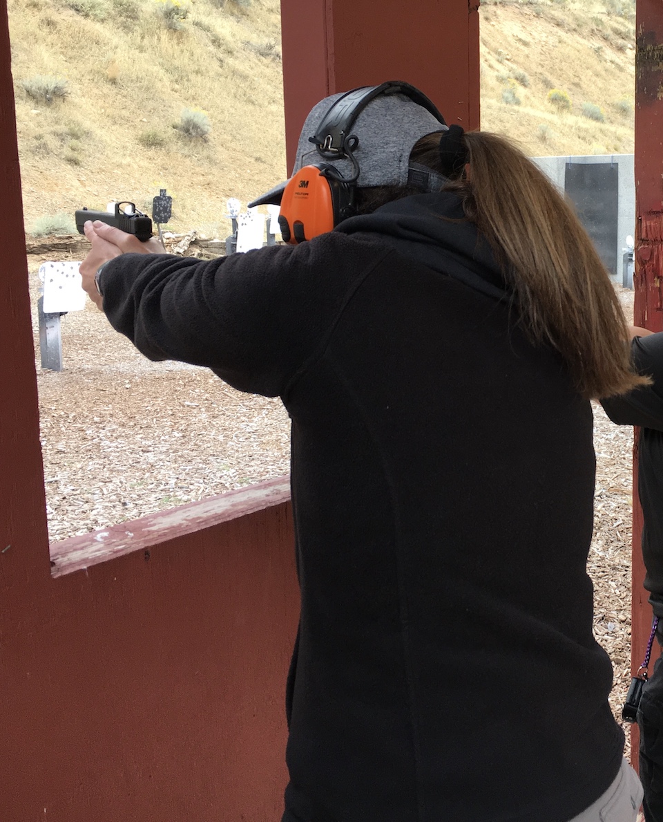 Kelly shooting a Glock 19 with Red Dot at TWAW conference