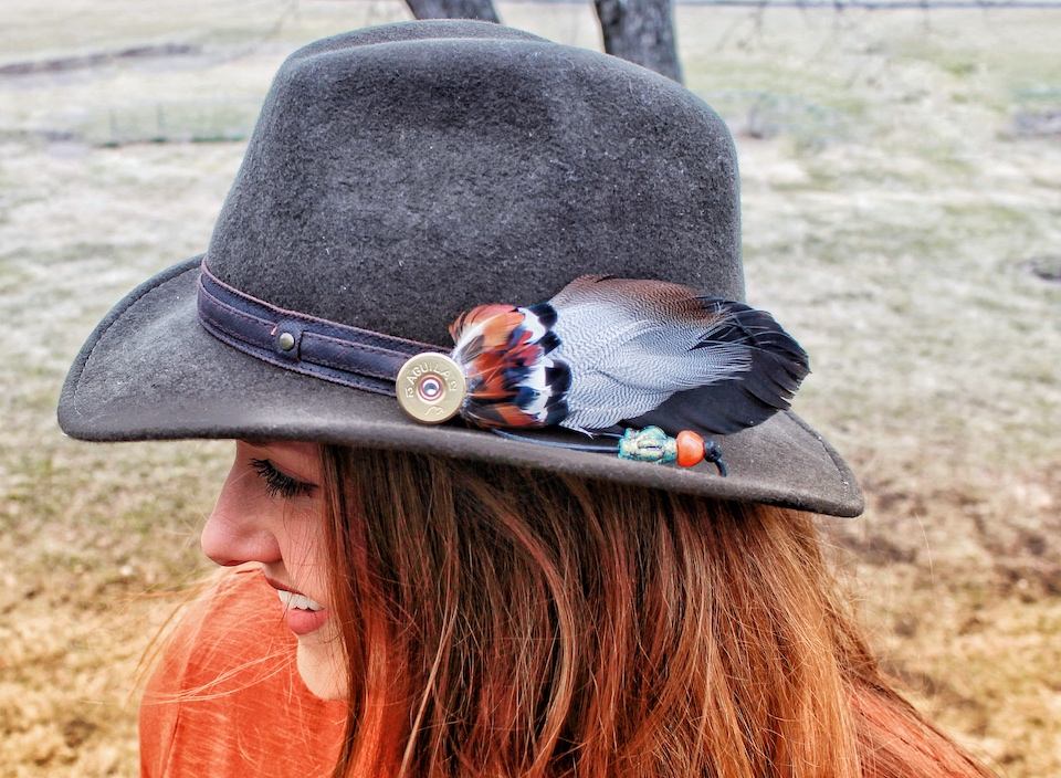 pheasant feather pendant on hat