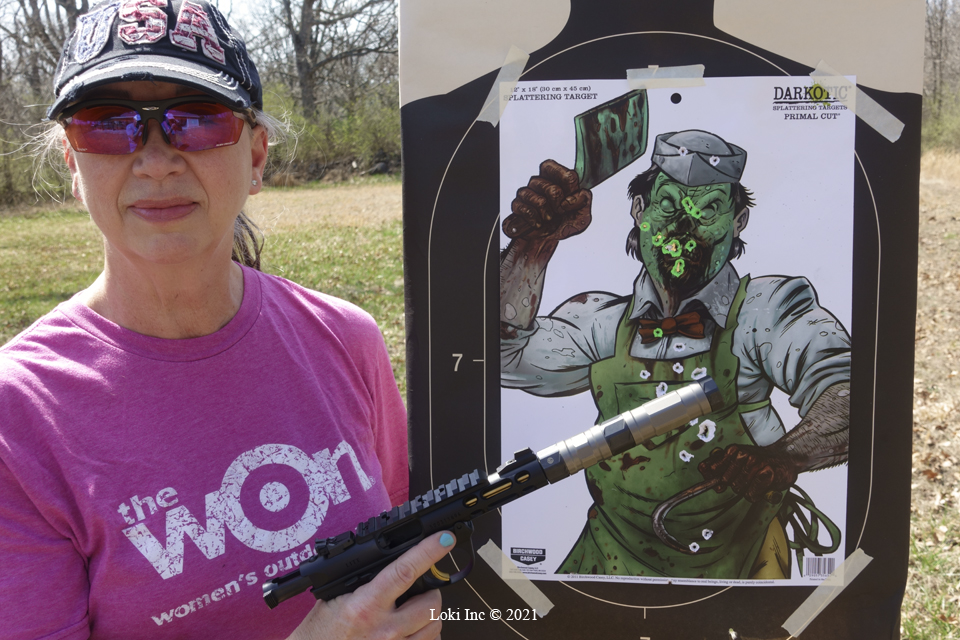 Barb with Ruger Mk4 Lite and Switchback suppressor in front of zombie target Plinking