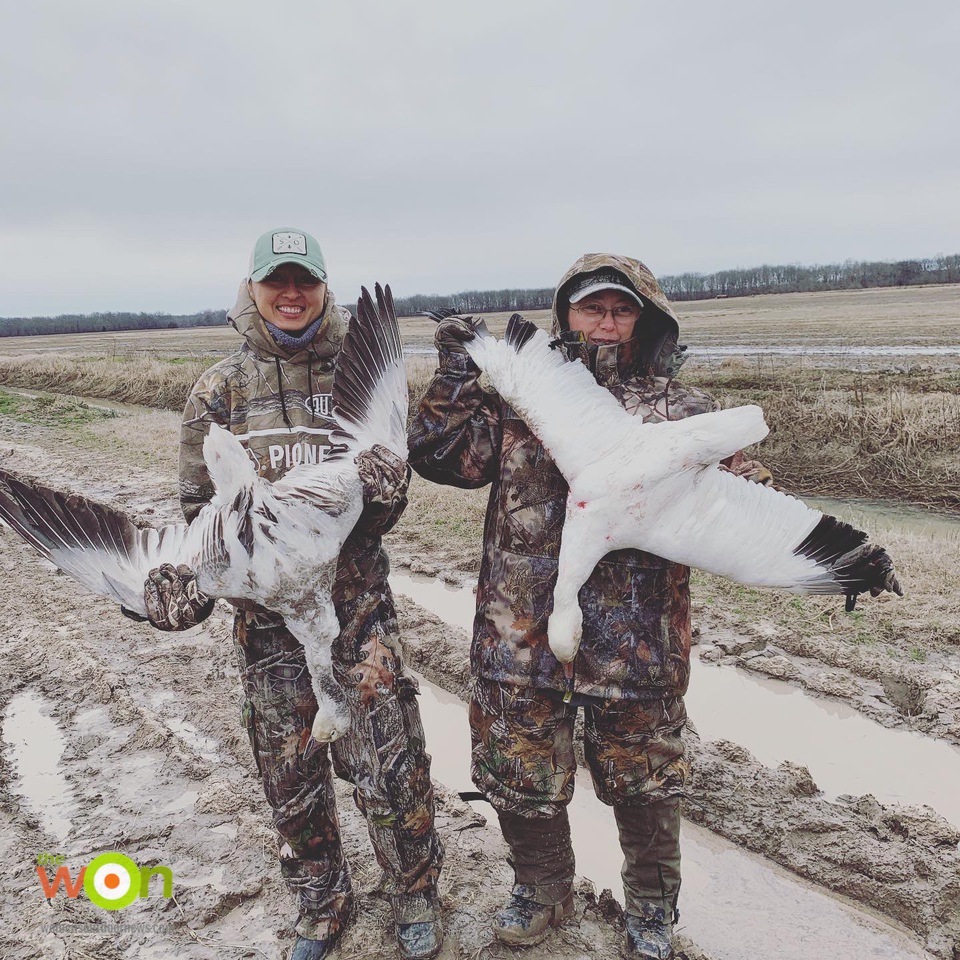 Jen Barcklay and Kelsi Beam in goose field on the Arkansas Goose Hunt