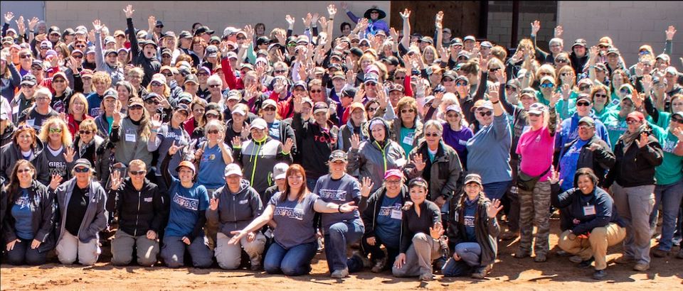 A Girl & A Gun Members surround Julianna Crowder and Robyn Sandoval at a training event.