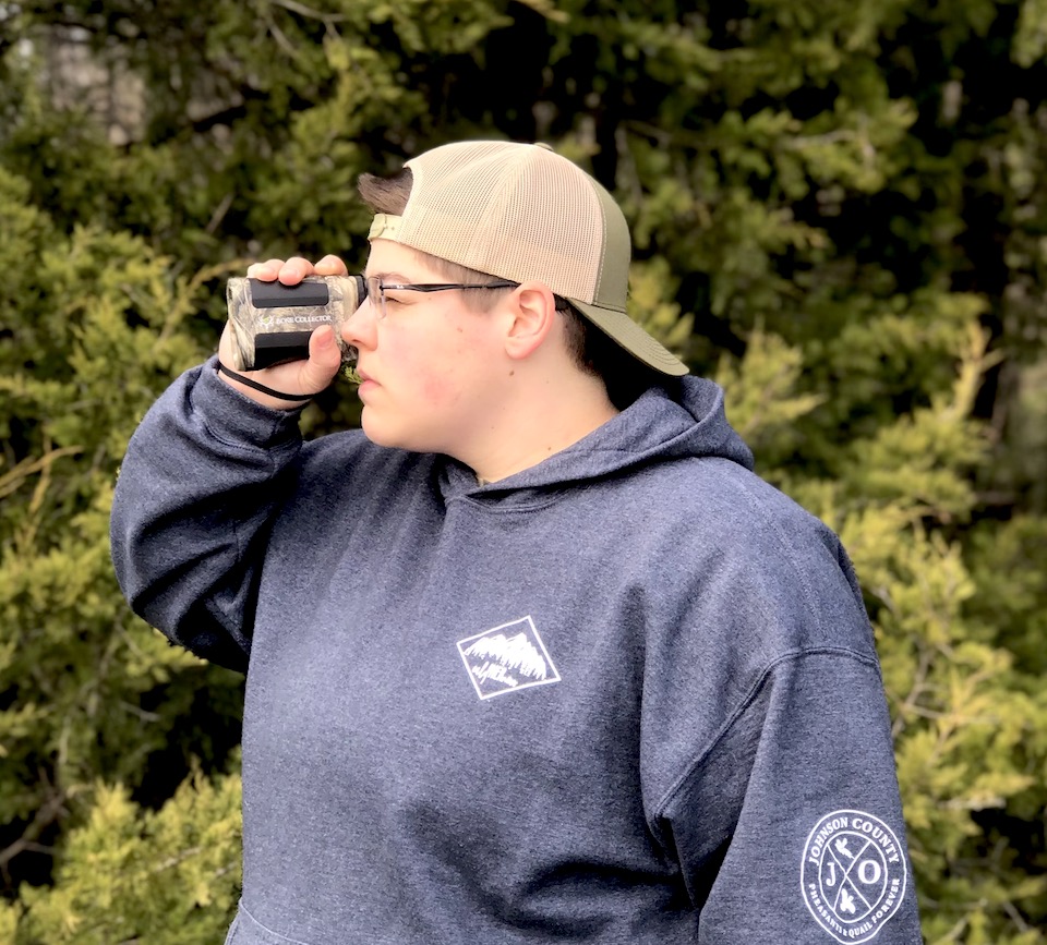 woman with bushneell rangefinder