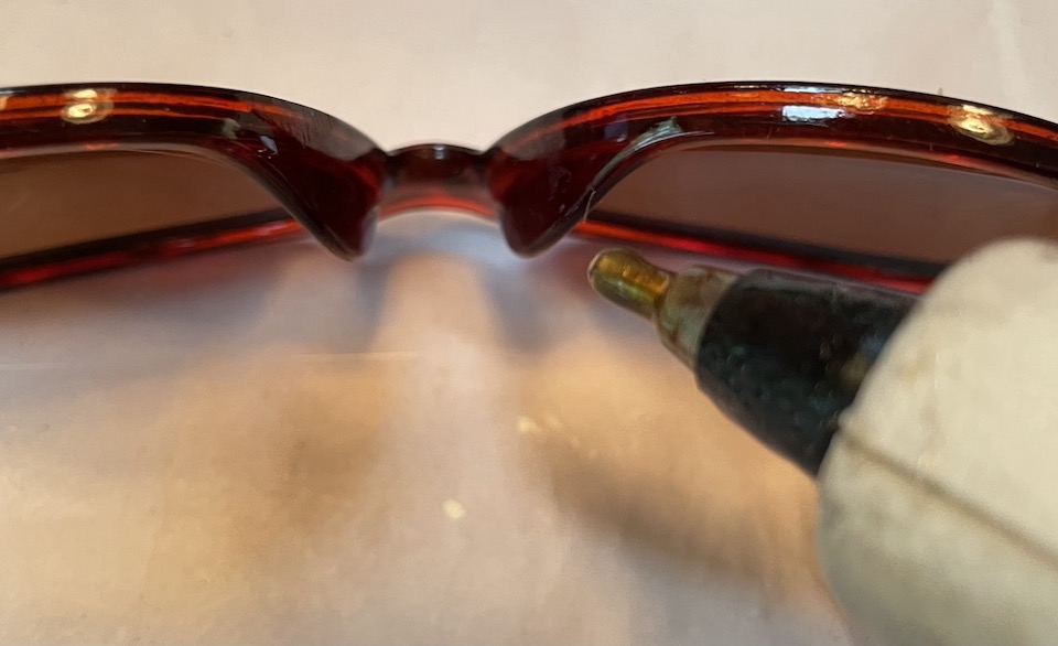 add hot glue to sunglasses