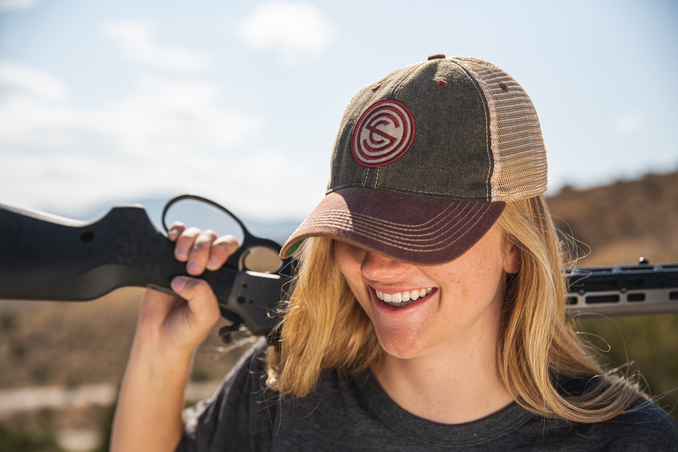 woman with shotgun over shoulder Female Initiative