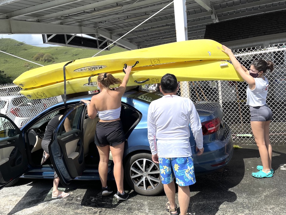 Carlos supervising the loading of kayaks for their Kayaking excursion