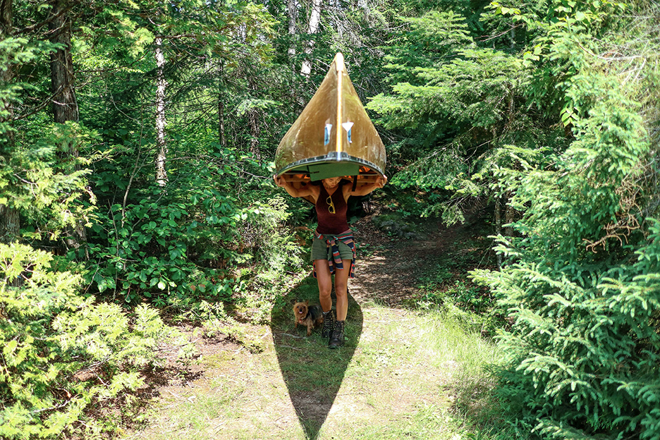 Jenny Anderson carries canoe