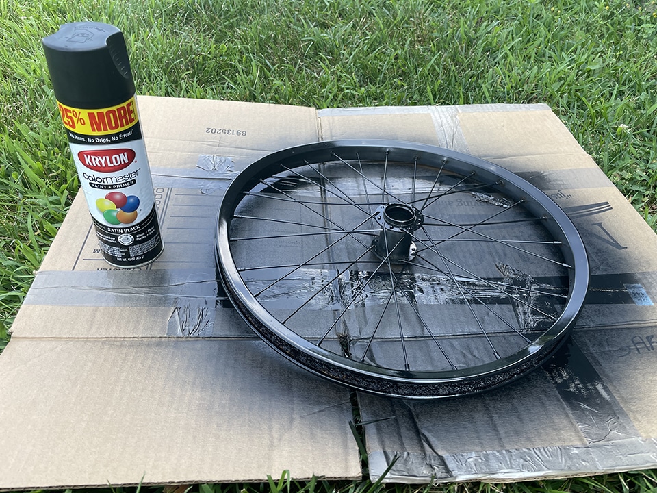 Spray painting the bike wheel