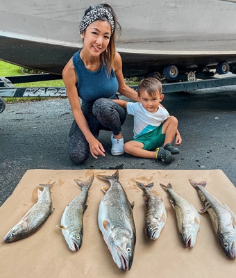 Jenny and son with lake trout catch feature