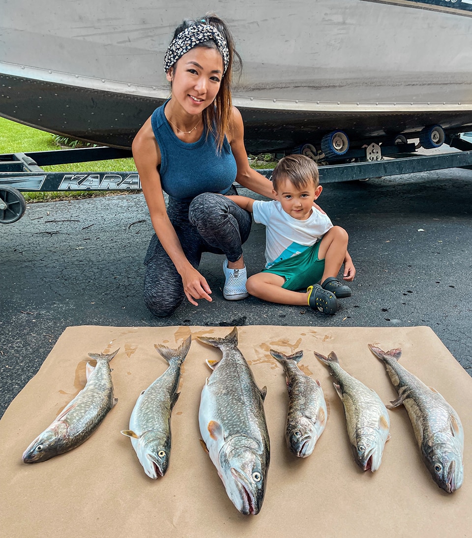 Jenny and son with lake trout catch