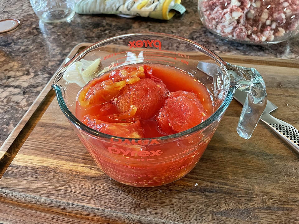 Measuring Out the Canned Tomatoes