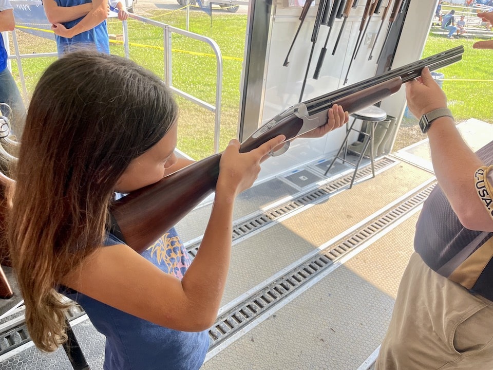 girl in trailer with cz shotgun