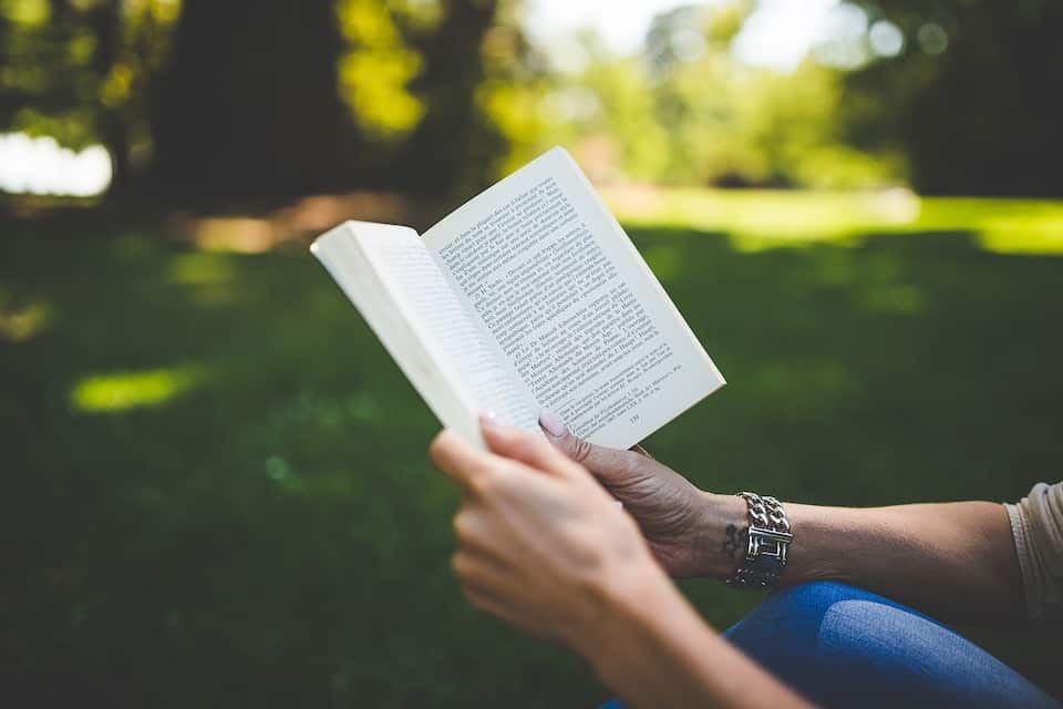 woman reading book Domestic Abuse