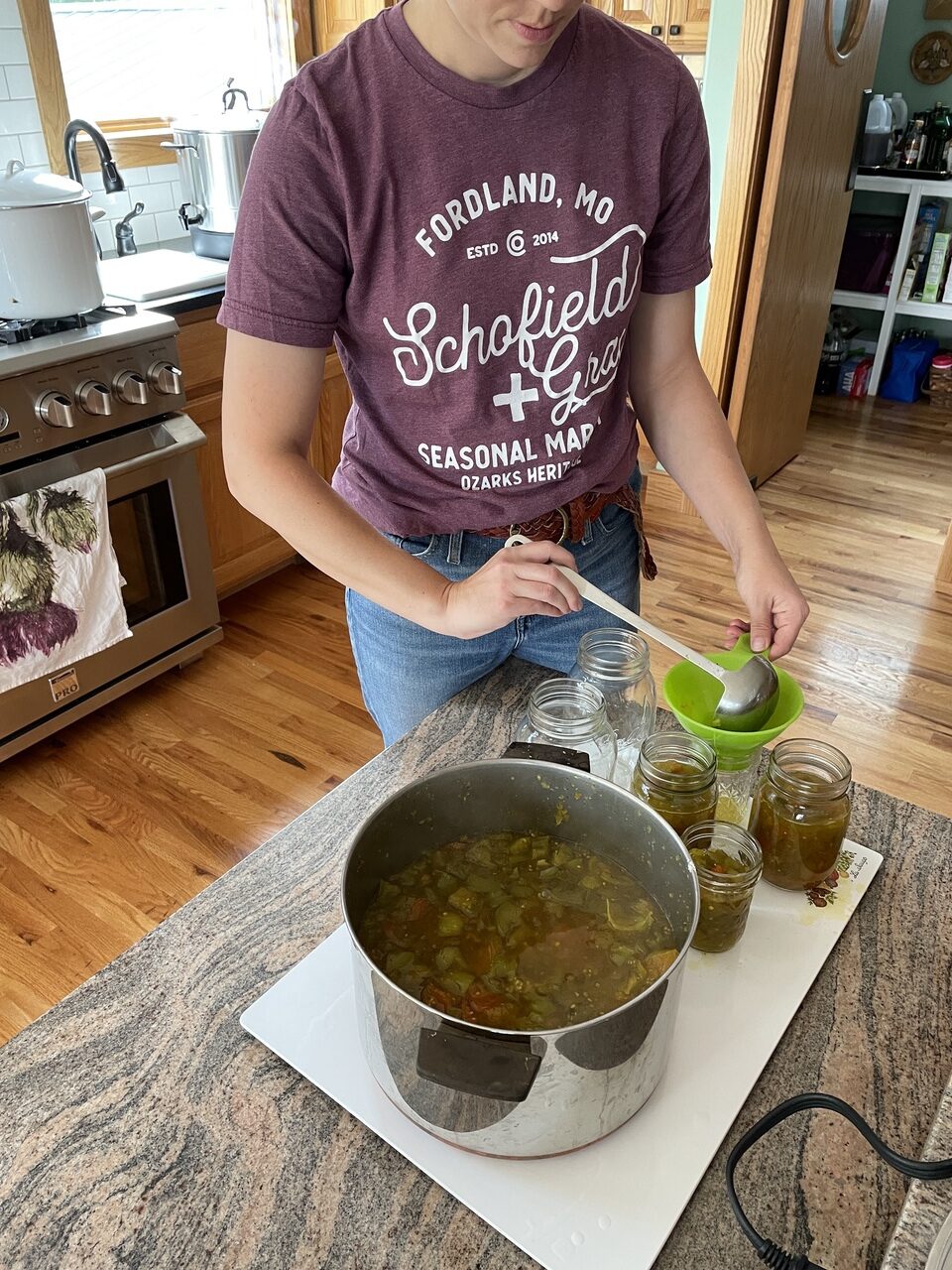 pouring hot tomato relish