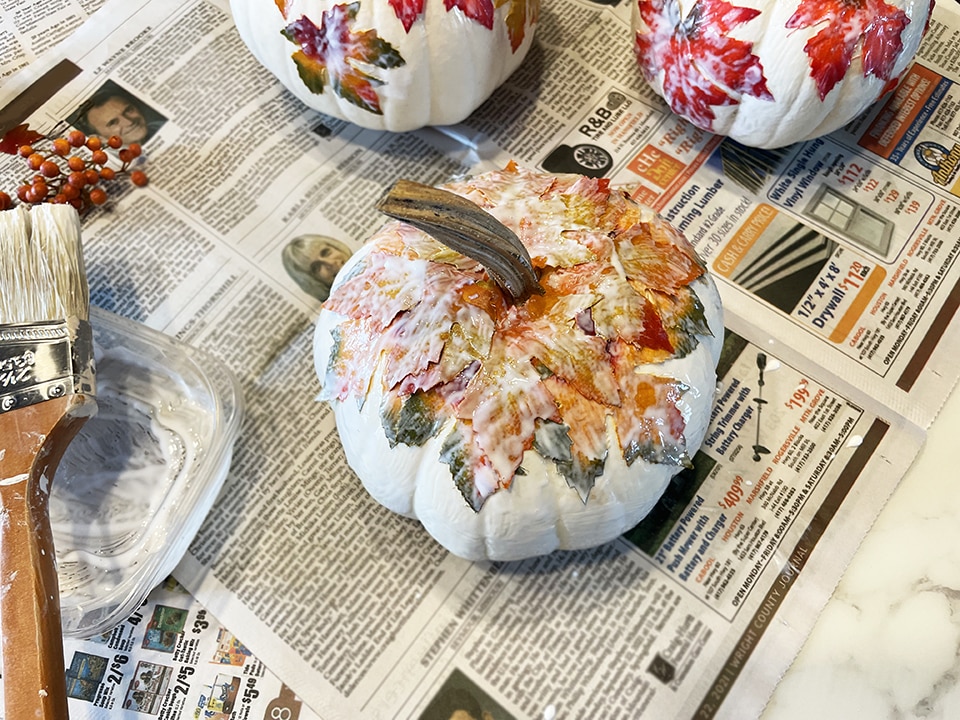Adding a second layer of leaves third pumpkin