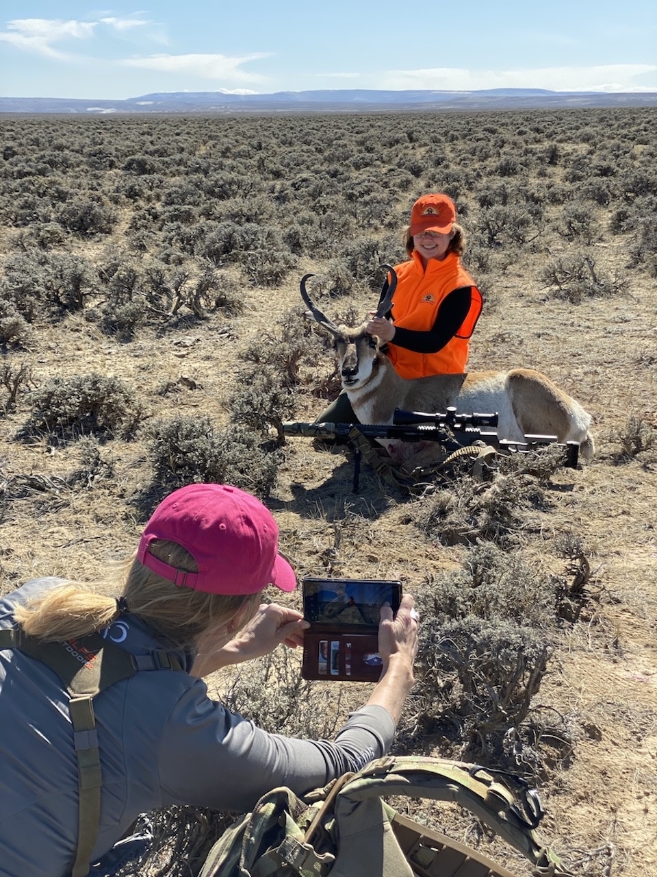 Mentor Cindi takes a photo with Anna and her pronghorn Oconto River Kids