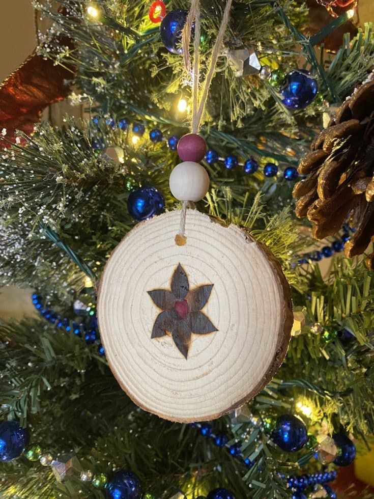 Anna's poinsetta wood cookie ornament with pokeberry stain