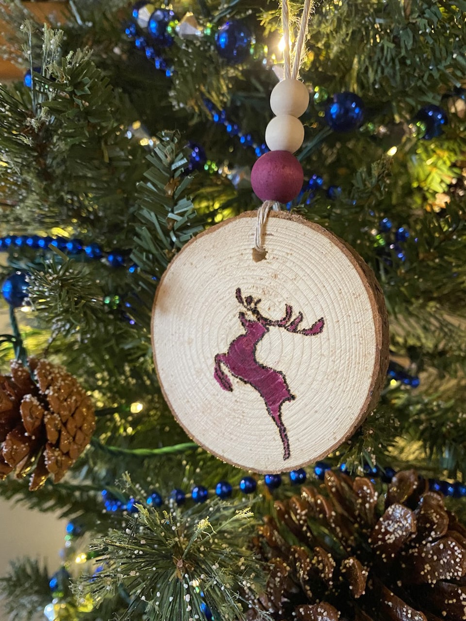 Rose's reindeer wood christmas ornament with pokeberry stain