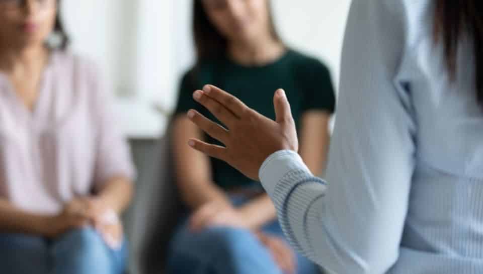 woman speaking to friends