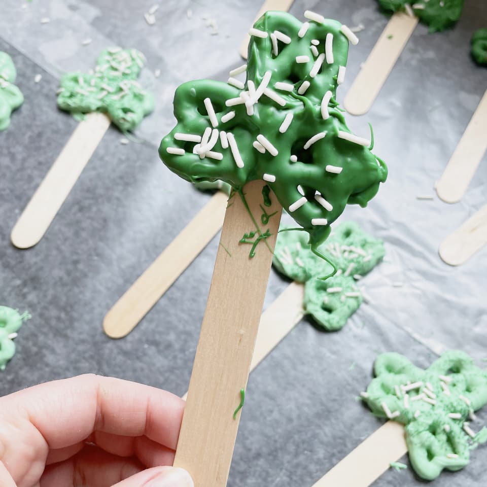 Shamrock Pretzel Treats adding sprinkles 2