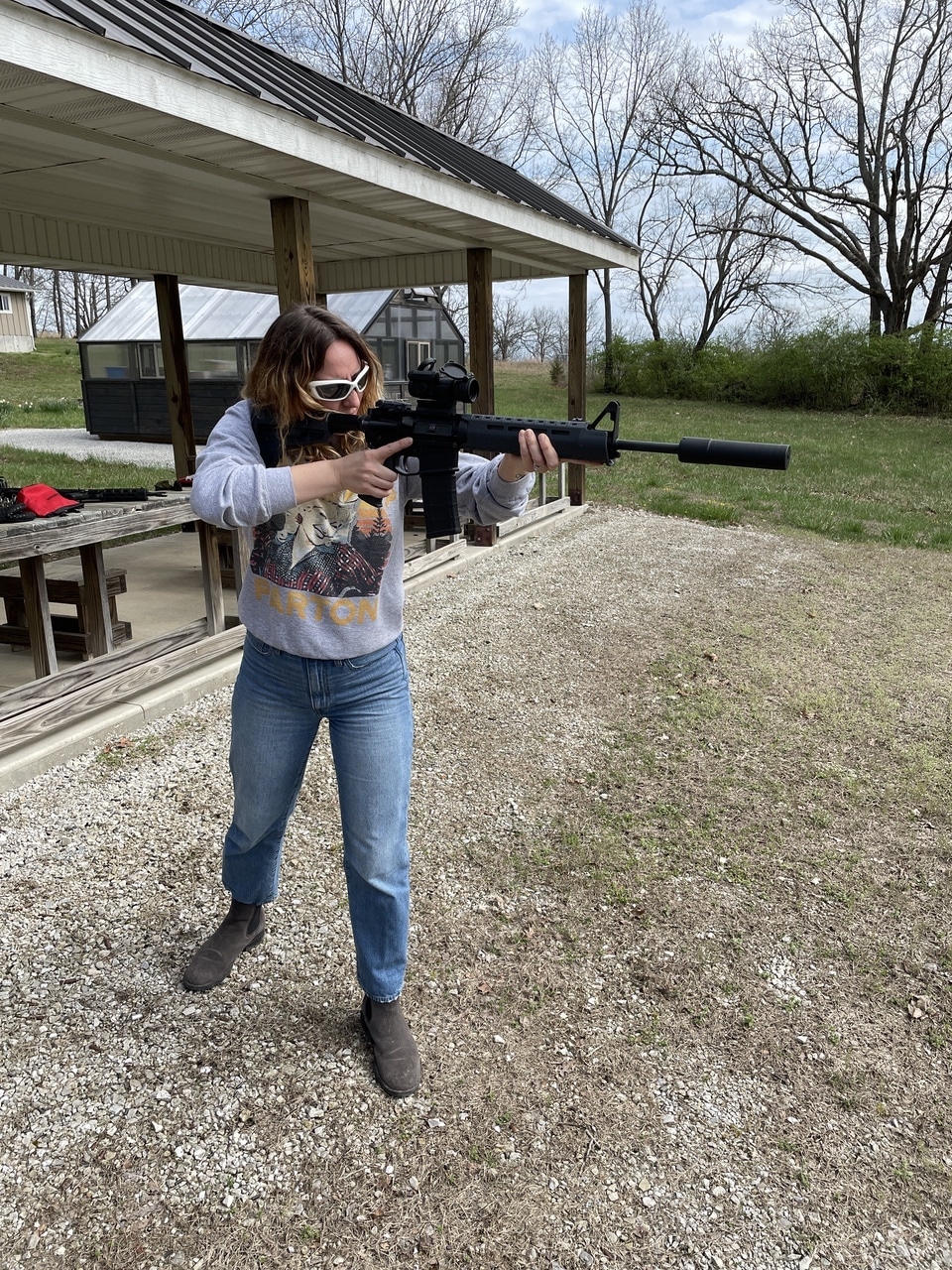 Woman with EVO Harvester SilencerCo suppressors