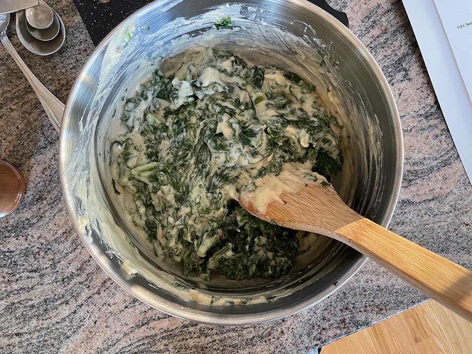 Kale Madeleine adding the kale