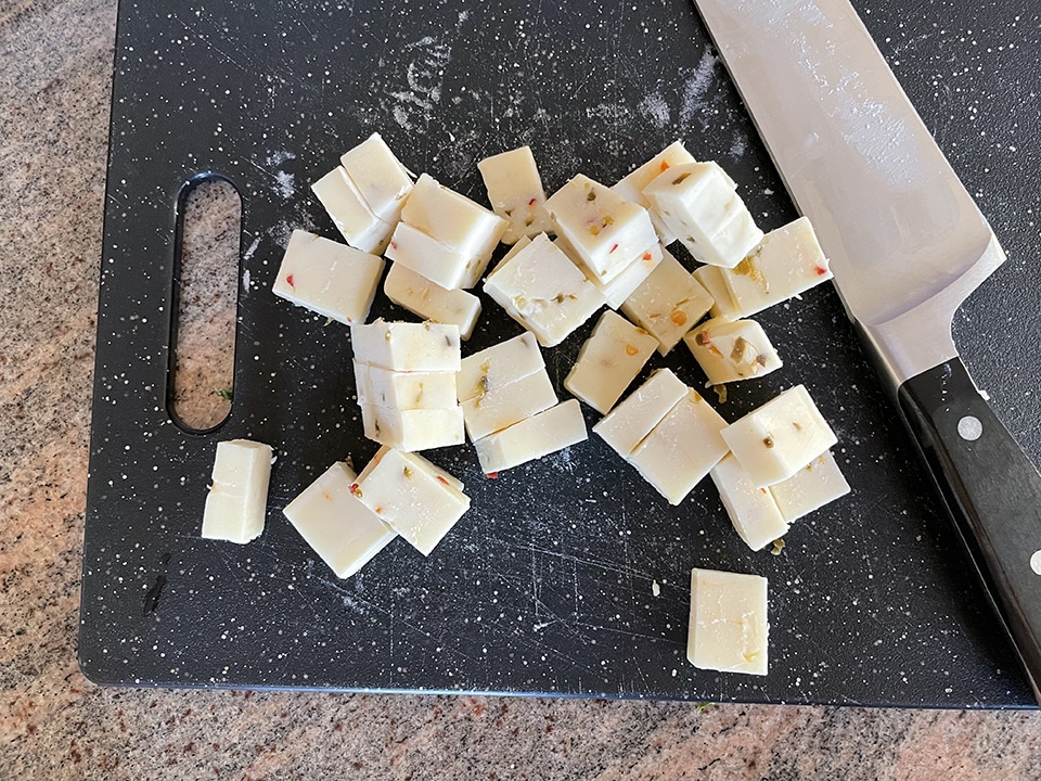 chopping the pepper jack cheese