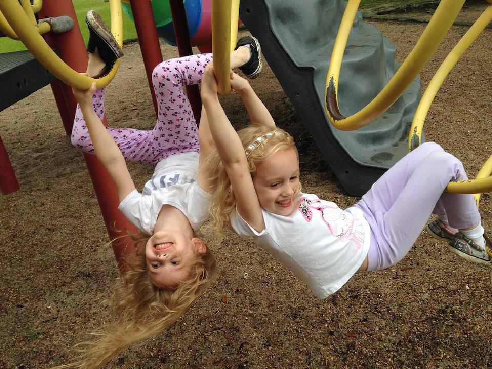 child on monkey bars Outdoor Safety Tips for Kids