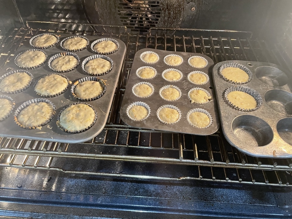 dandelion muffins in tins in oven
