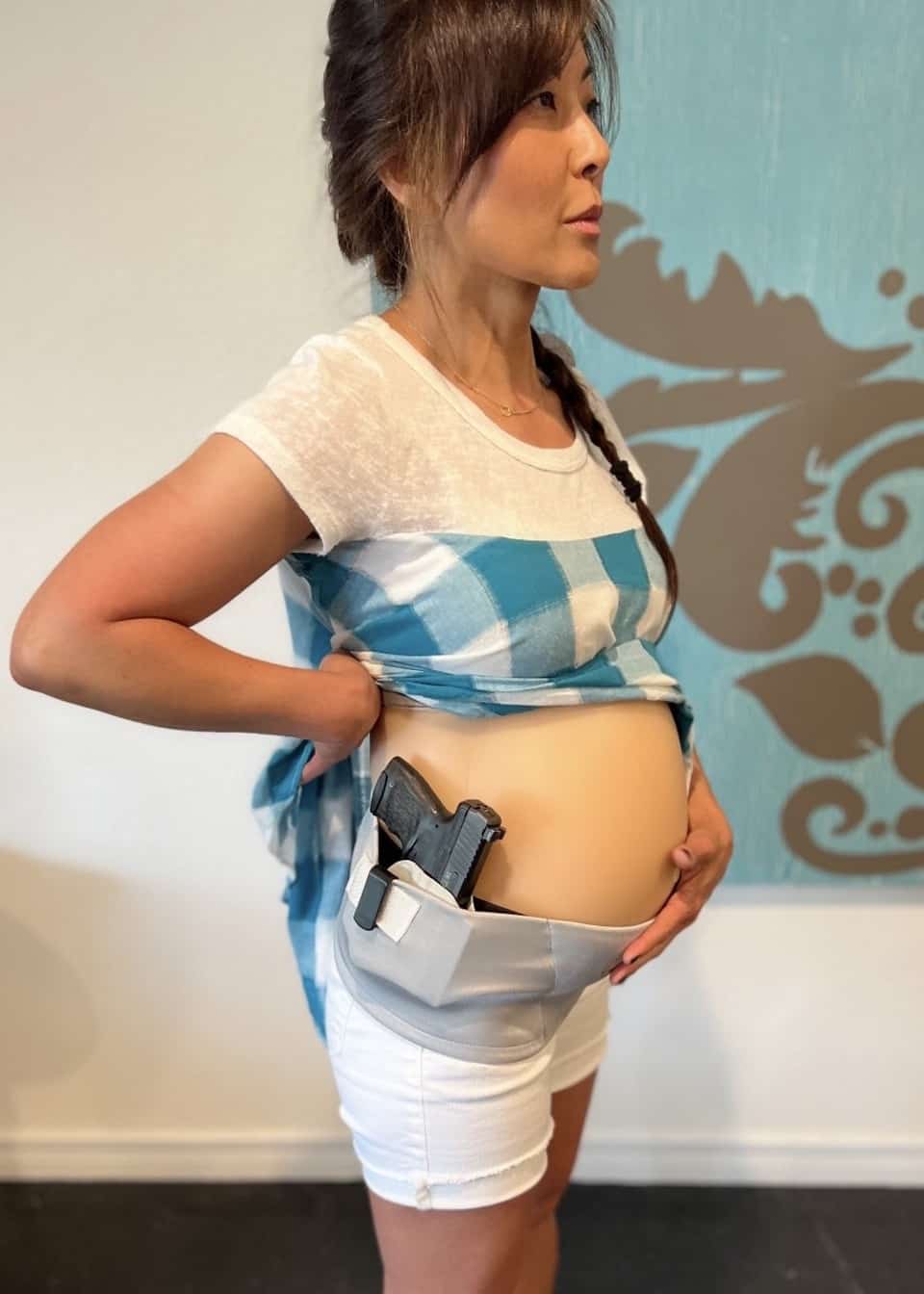 Michelle Waldron packing and pregnant