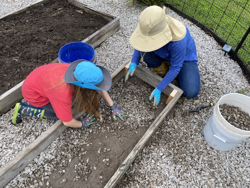 Clearing out the gravel for soil