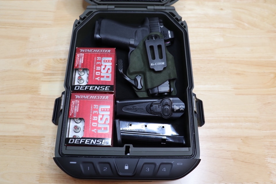 Everday-carry-items-stored-in-Vaultek-safe
traveling by air with firearms