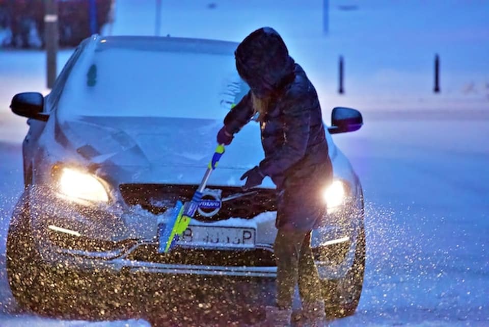 cleaning snow off car