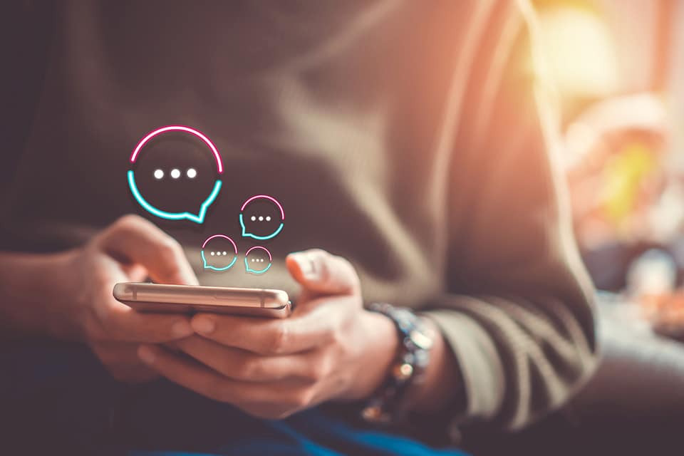 Women hand using smartphone typing, chatting conversation in cha