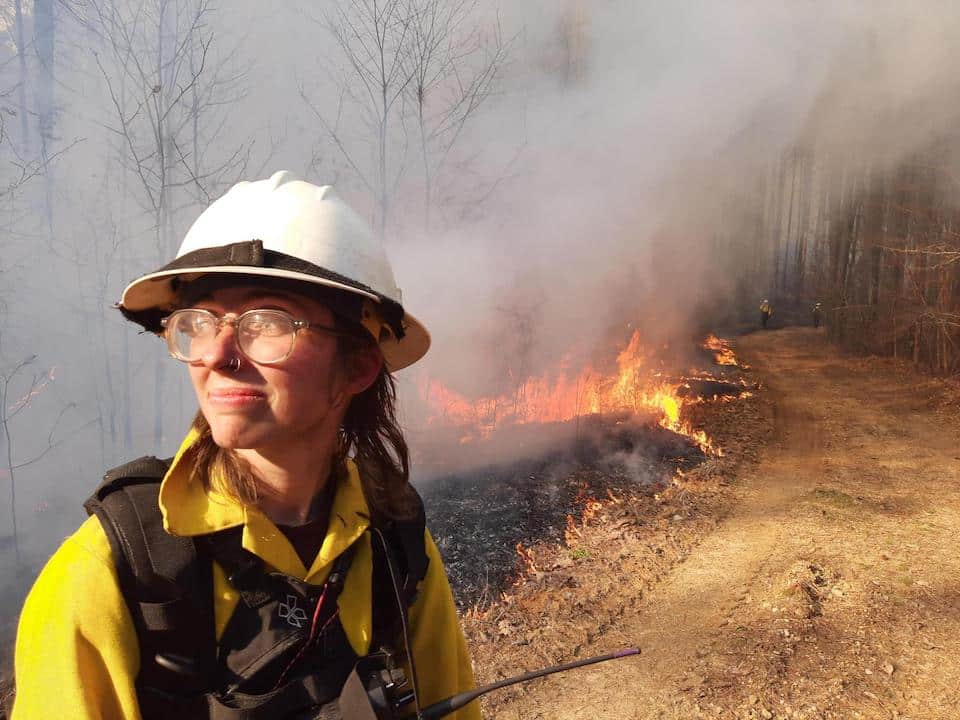 When initiating a prescribed fire, it is important to determine the type of ignition pattern or combination of patterns before the burn. Sam Munson, Student Conservation Association intern and crewmember of the Forest Service's all-female wildland fire crew, pops out on the road after making an ignitions pass on a 1,000-acre burn on the Tombigbee National Forest in Mississippi. The crew will work and travel throughout the Southern Region, gaining hands-on experience in fire and fuels management work. (USDA Forest Service photo by Megan Saylors)