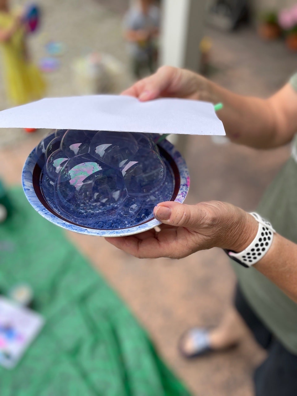 pressing paper on bubble art