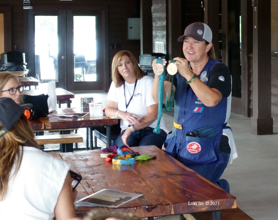 Kim showing her medals Beretta Shotgun Experience